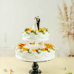 2-Tier Wedding cake placed in a cake stand