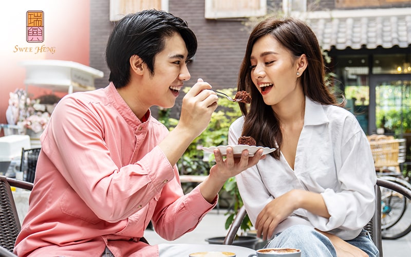 Couple sharing cake for anniversary